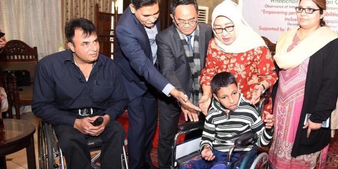 Indonesian embassy distributes wheel-chairs among special persons