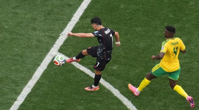 Canada reach World Cup last 16 as late strike sinks South Africa