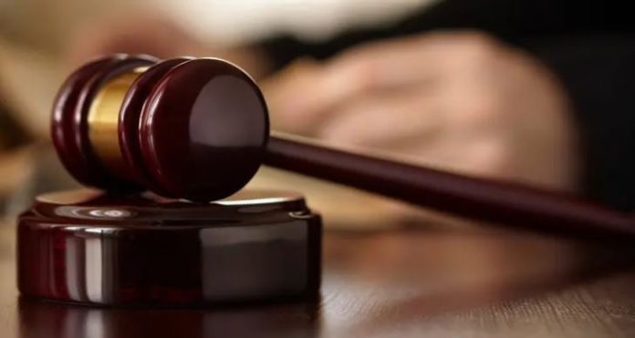 Federal judge bars Trump from implementing proof of citizenship requirement to vote