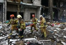 Russian strike kills 14 around Kyiv on eve of NATO summit Russian strike kills 14 around Kyiv on eve of NATO summit